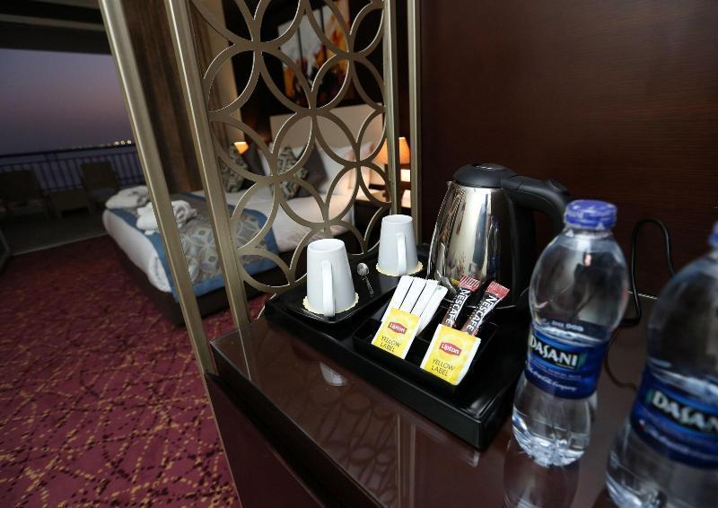 Tolip El Forsan Hotel Исмаилия Екстериор снимка Bottled water in a hotel room